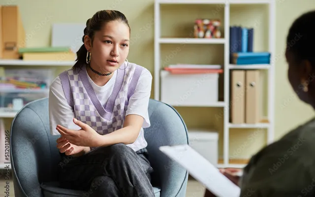 Teen in supportive therapy environment